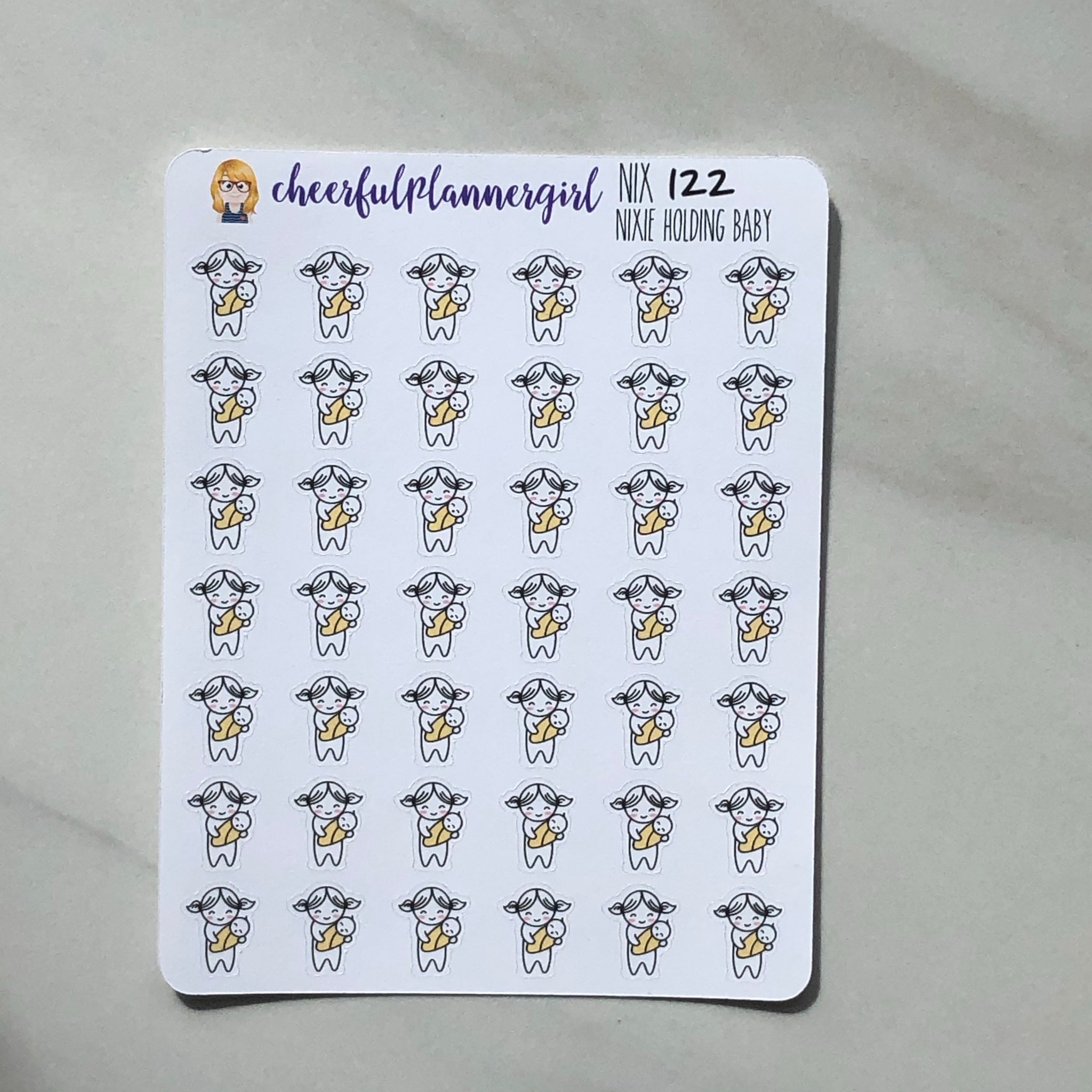Nixie holding Baby Planner Stickers